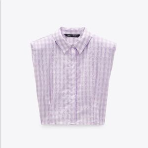 Sleeveless shirt with shoulder pad